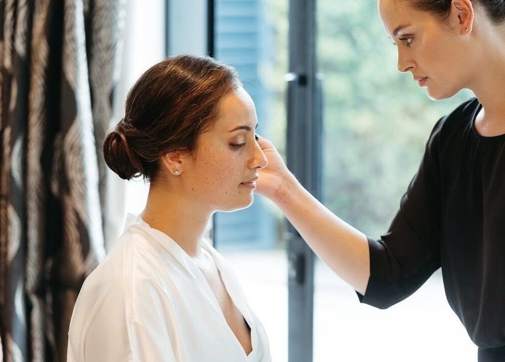 Beauty treatment session at Image by Imogen, Auckland, Auckland, NZ. A woman receives a calming facial touch.