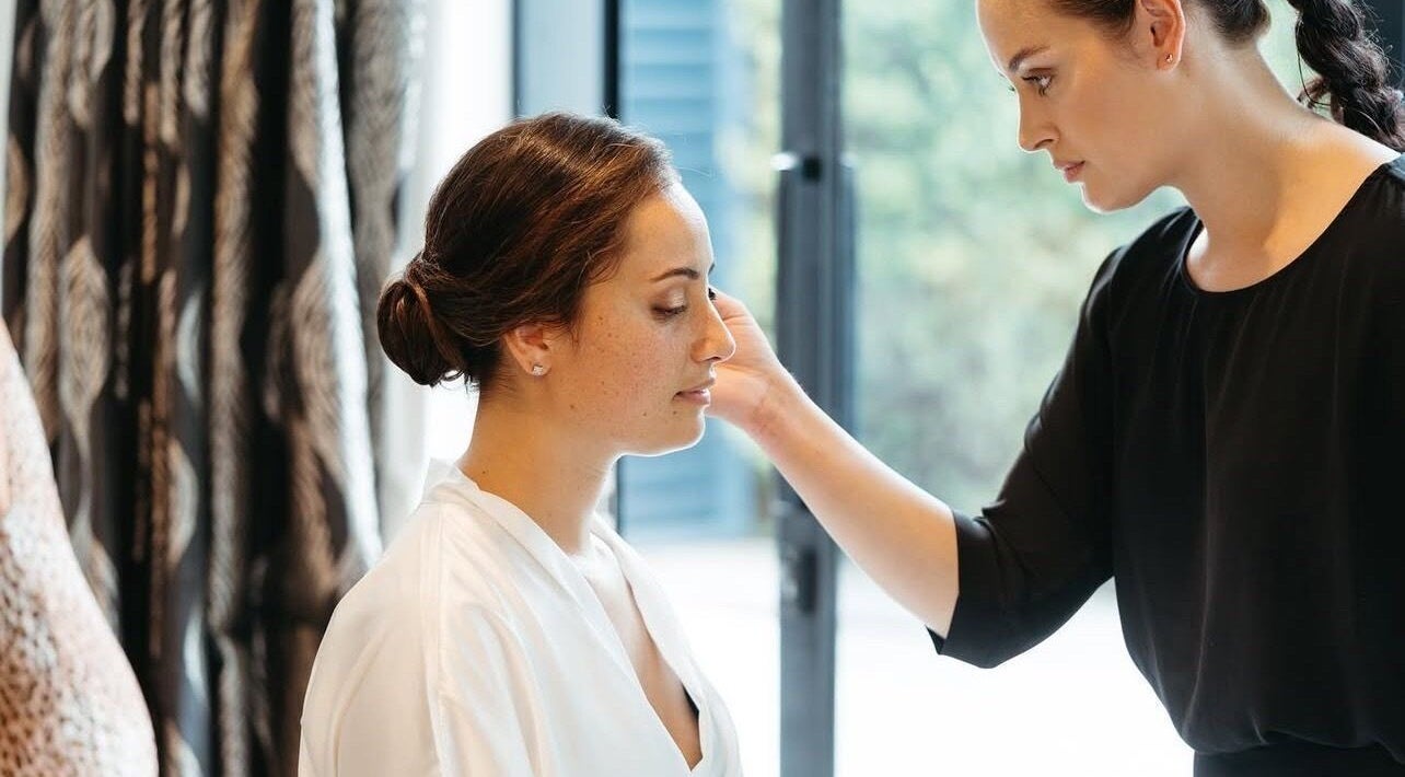 Beauty treatment session at Image by Imogen, Auckland, Auckland, NZ. A woman receives a calming facial touch.
