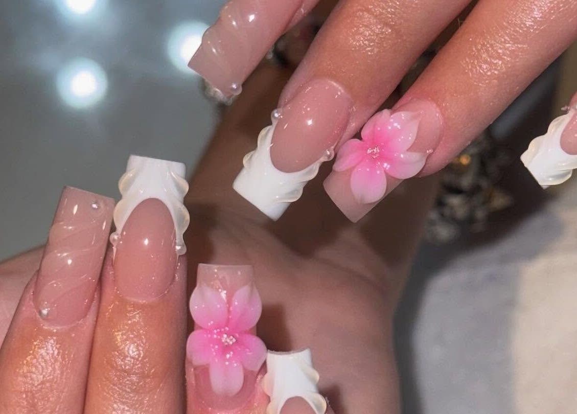 Beautiful floral nail art at Elegant Nails and Spa, London, Ontario, CA showcasing intricate pink designs.