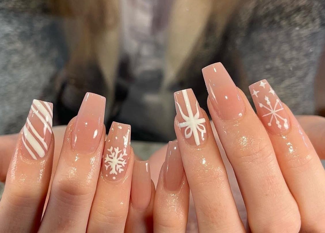 Elegant Nails and Spa in London, Ontario, CA offers stunning winter-themed nail art with intricate designs.