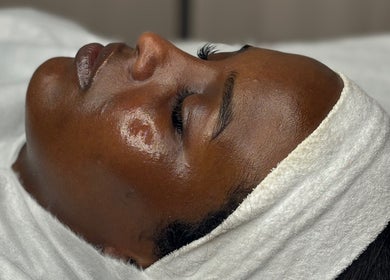 Relaxed facial treatment at By Beauty Academy, Manchester, England, GB, showcasing glowing skin.