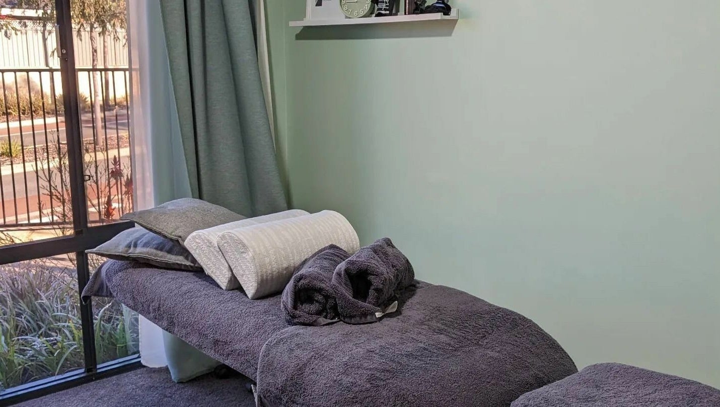 A relaxing massage room at Eucalypt Remedial Massage, Wellard, Western Australia, AU with soft towels and natural light.