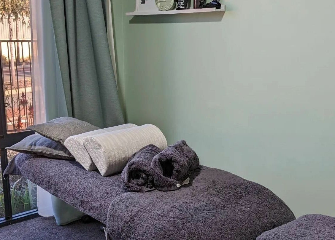 A relaxing massage room at Eucalypt Remedial Massage, Wellard, Western Australia, AU with soft towels and natural light.