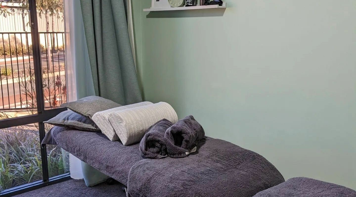 A relaxing massage room at Eucalypt Remedial Massage, Wellard, Western Australia, AU with soft towels and natural light.