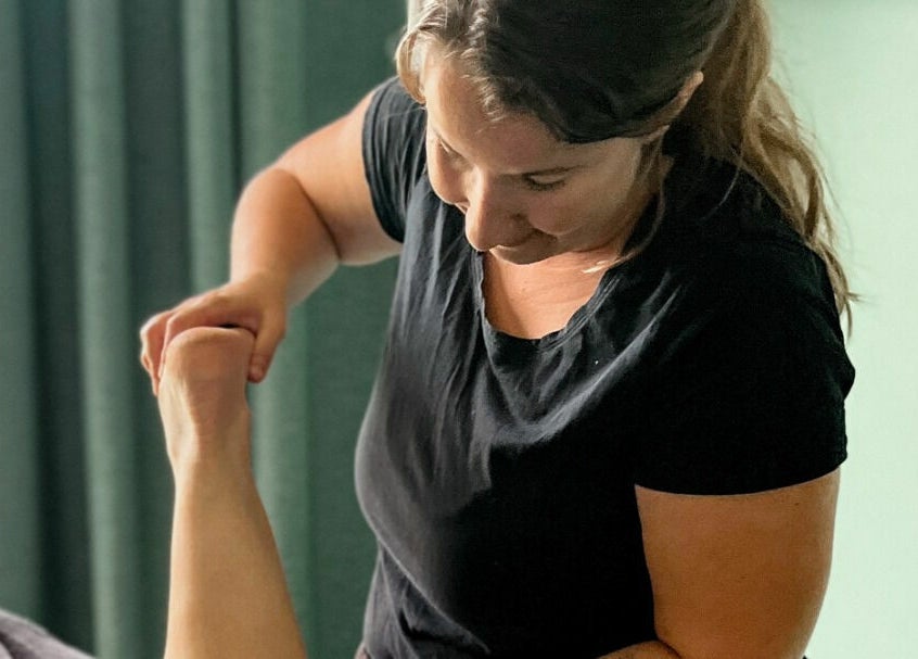 Therapist performing leg massage at Eucalypt Remedial Massage, Wellard, Western Australia, AU.