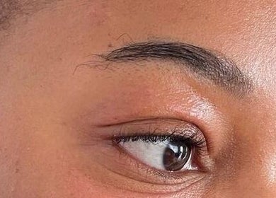 Close-up of perfectly shaped eyebrow at Glamfair Beauty Bar, Randburg, Gauteng, ZA, showcasing expert grooming.