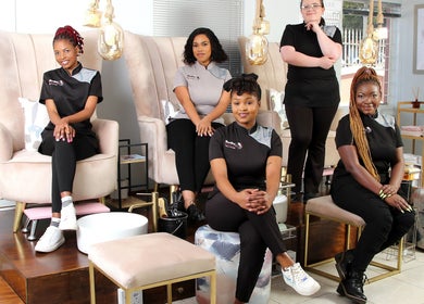 Team at Black Bird Beauty Spa, Roodepoort, Gauteng, ZA in a chic lounge setting.