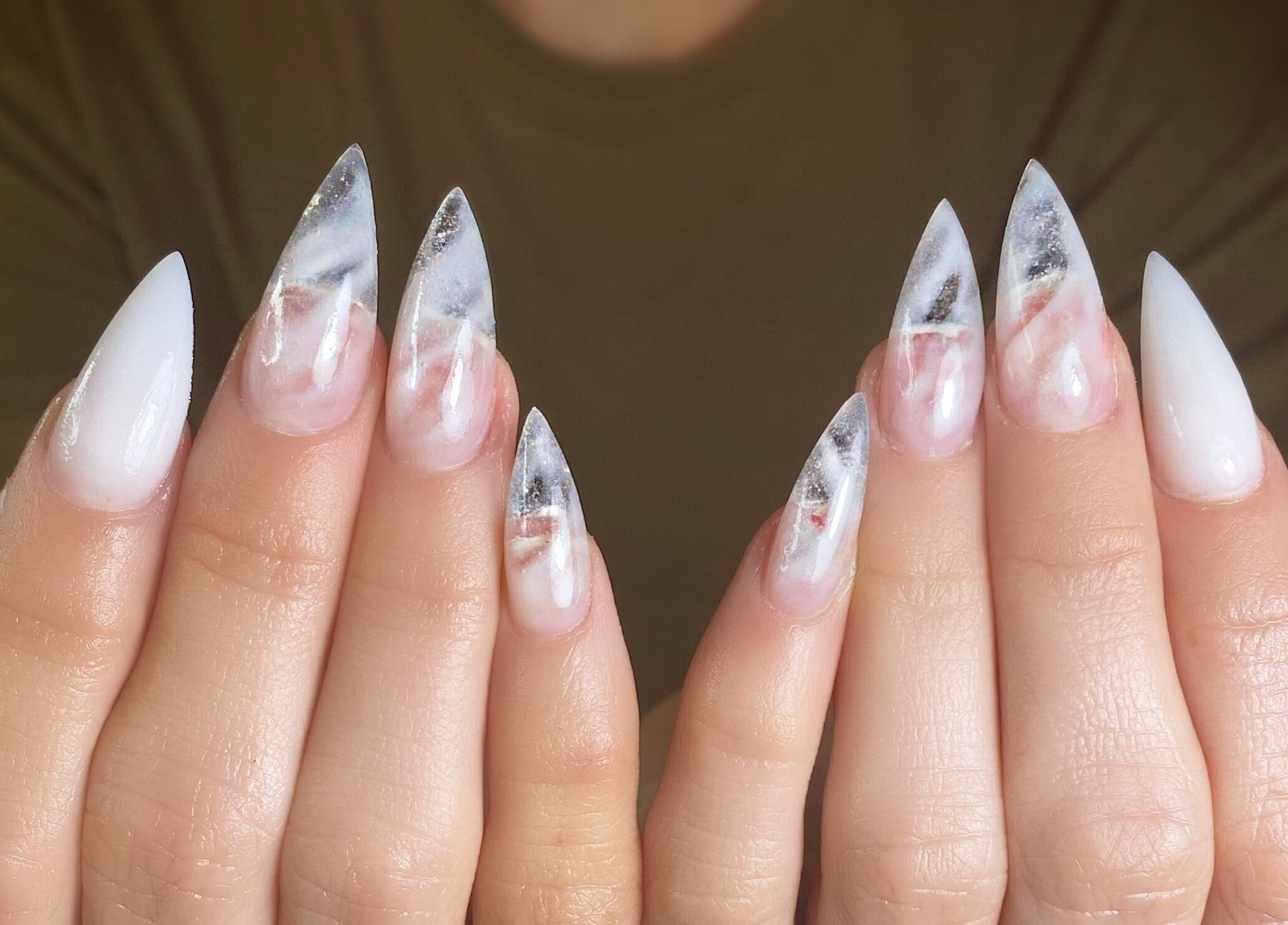 Elegant marbled nail art at Nails by Belle, Budgewoi, NSW, AU, featuring white and smoky grey tones.