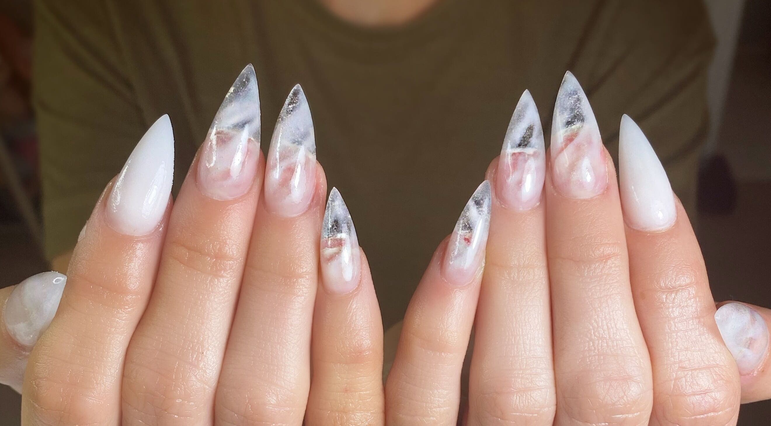 Elegant marbled nail art at Nails by Belle, Budgewoi, NSW, AU, featuring white and smoky grey tones.