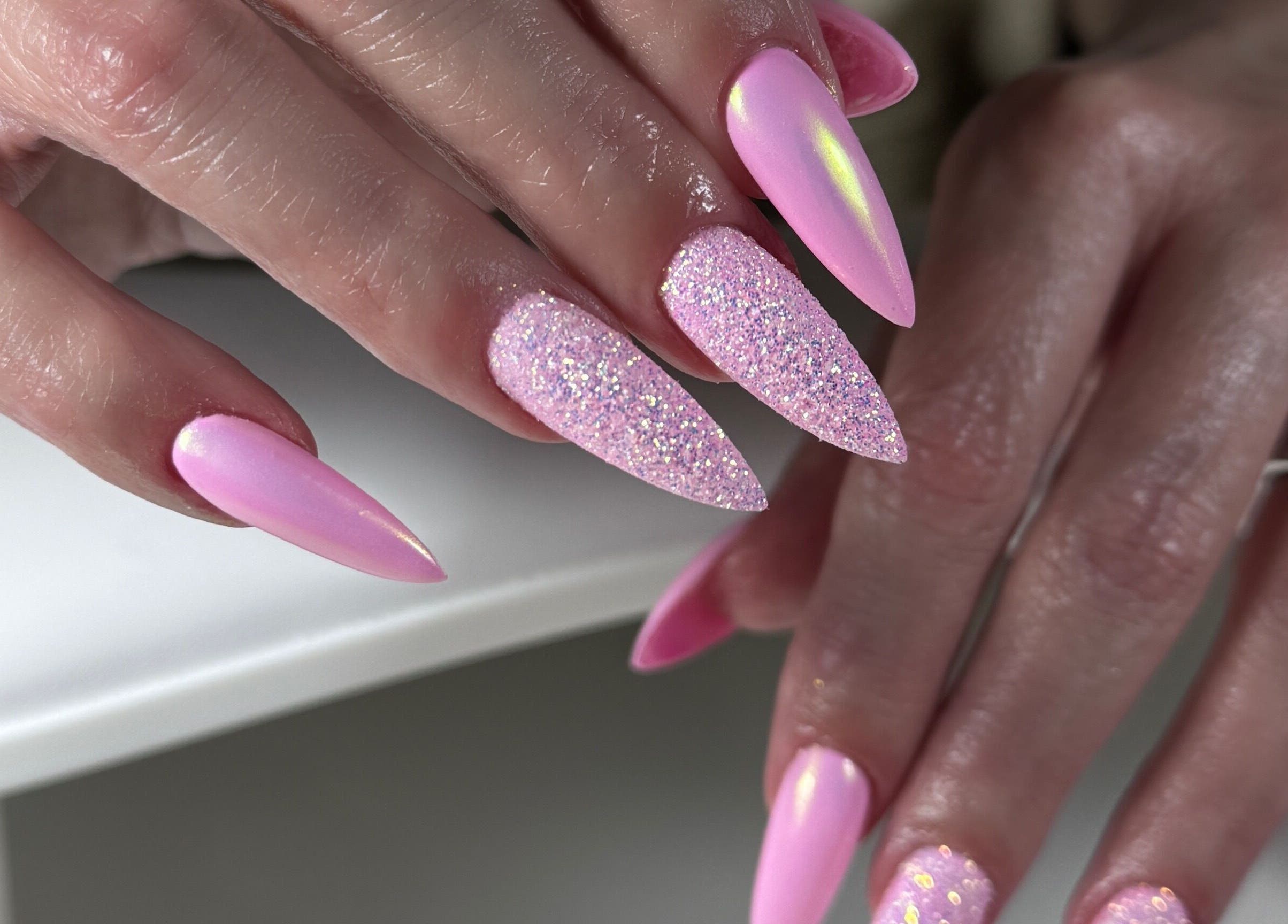 Elegant pink glitter nails from Nails by Belle, Budgewoi, NSW, AU, showcasing exquisite artistry.