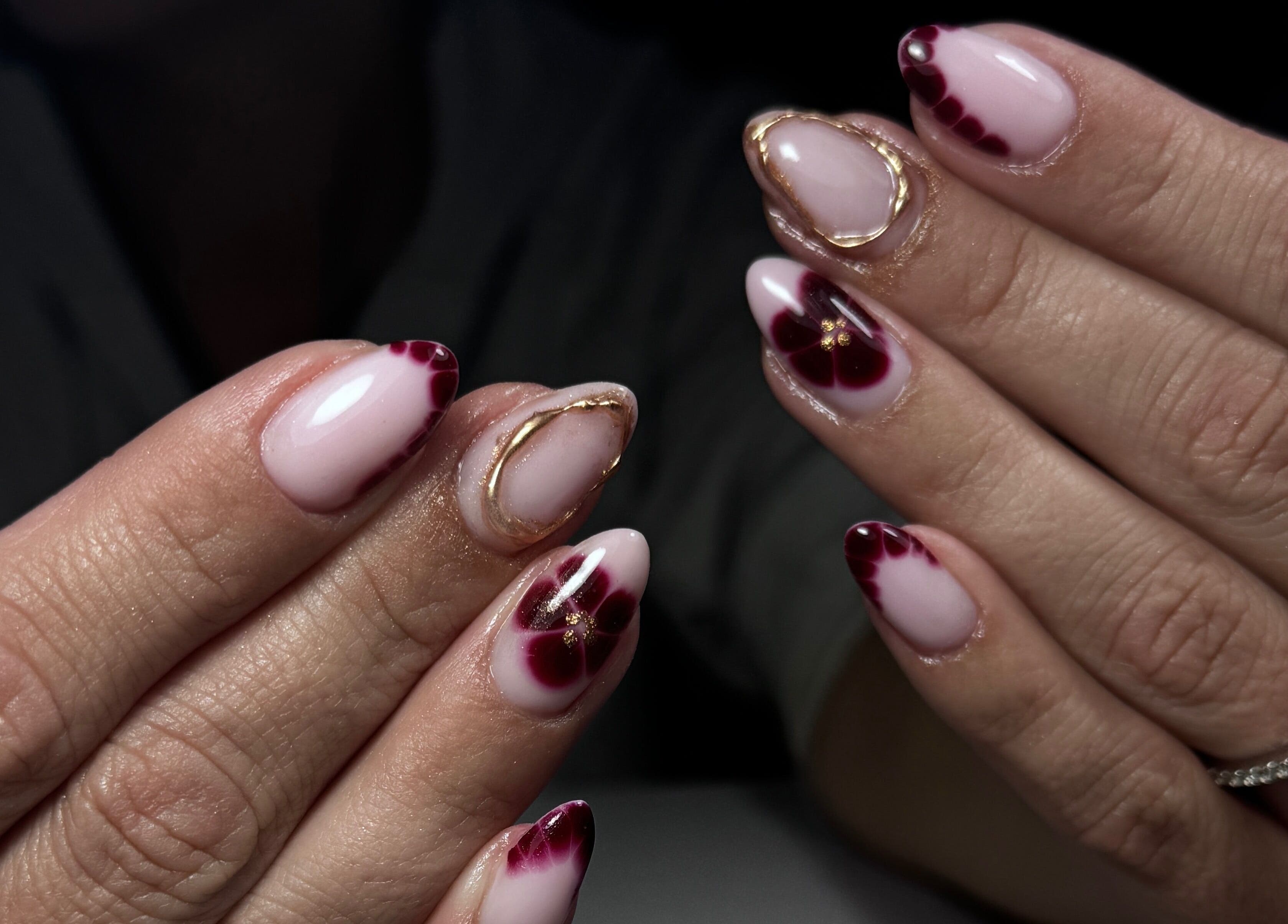 Stylish nail art displayed at Nails by Belle, Budgewoi, NSW, AU with intricate designs and glossy finish.