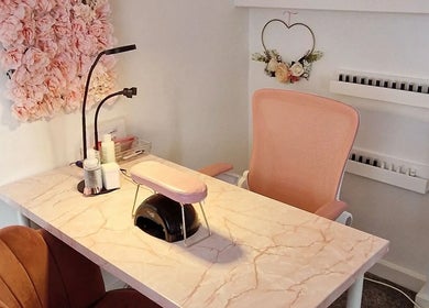 Chic nail station at Michelle Patterson Beauty, Washington, England with pink decor and floral accents.