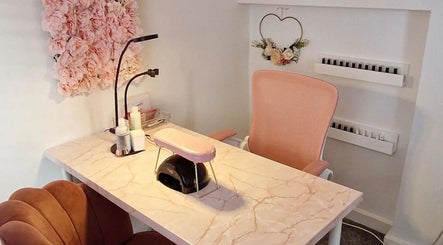 Chic nail station at Michelle Patterson Beauty, Washington, England with pink decor and floral accents.