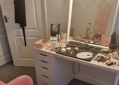 Makeup desk at Michelle Patterson Beauty in Washington, England, GB with cosmetics and brushes.