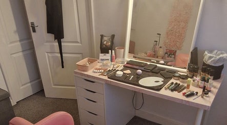 Makeup desk at Michelle Patterson Beauty in Washington, England, GB with cosmetics and brushes.