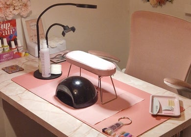 Elegant nail station at Michelle Patterson Beauty, Washington, England, GB showcasing tools and polish collection.