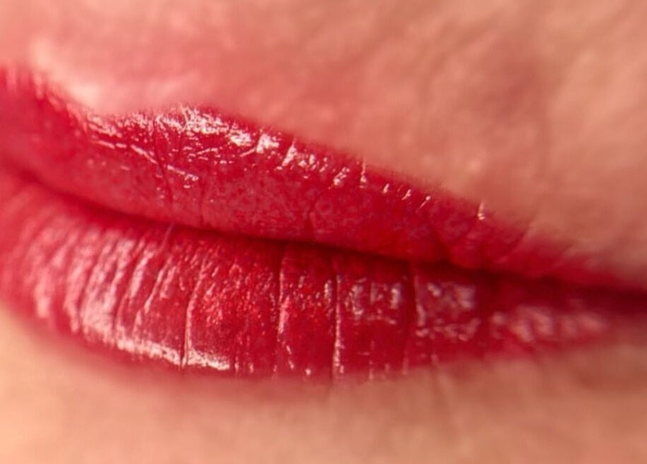 Vibrant red lips featuring tattoo artistry at Scalpture Ink, Johannesburg, Gauteng, ZA.