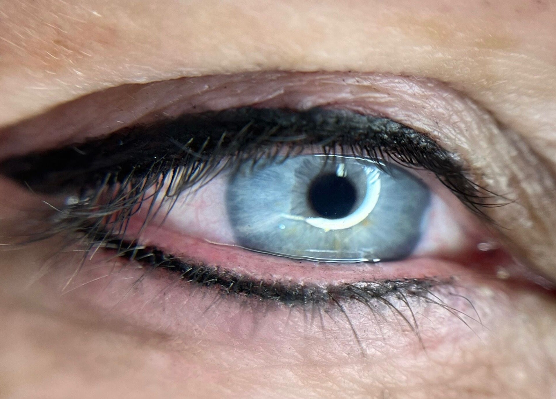 Close-up of a beautifully lined blue eye at Scalpture Ink, Johannesburg, Gauteng, ZA.