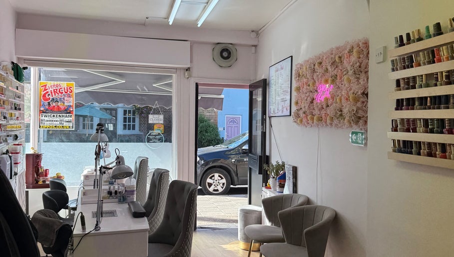 Interior of Kaites Nails in Twickenham, England, GB showcasing chairs, nail polish, and decor.