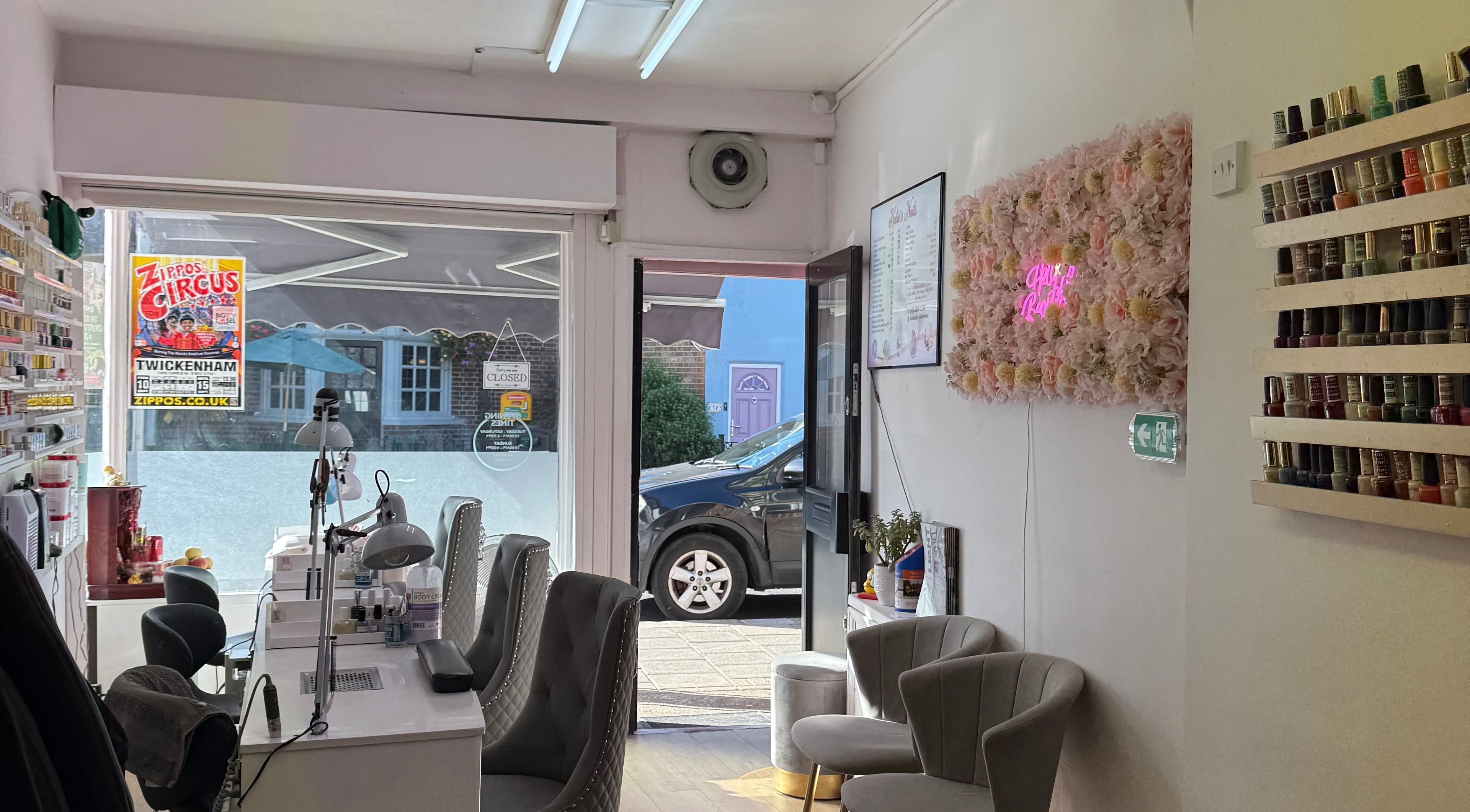 Interior of Kaites Nails in Twickenham, England, GB showcasing chairs, nail polish, and decor.