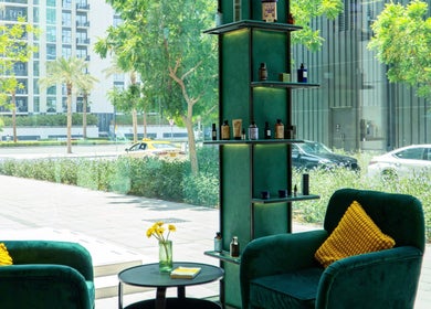 Cozy, sunlit lounge area at 717 Gents Salon | Dubai Hills, offering a serene view of Dubai, Dubai, AE.