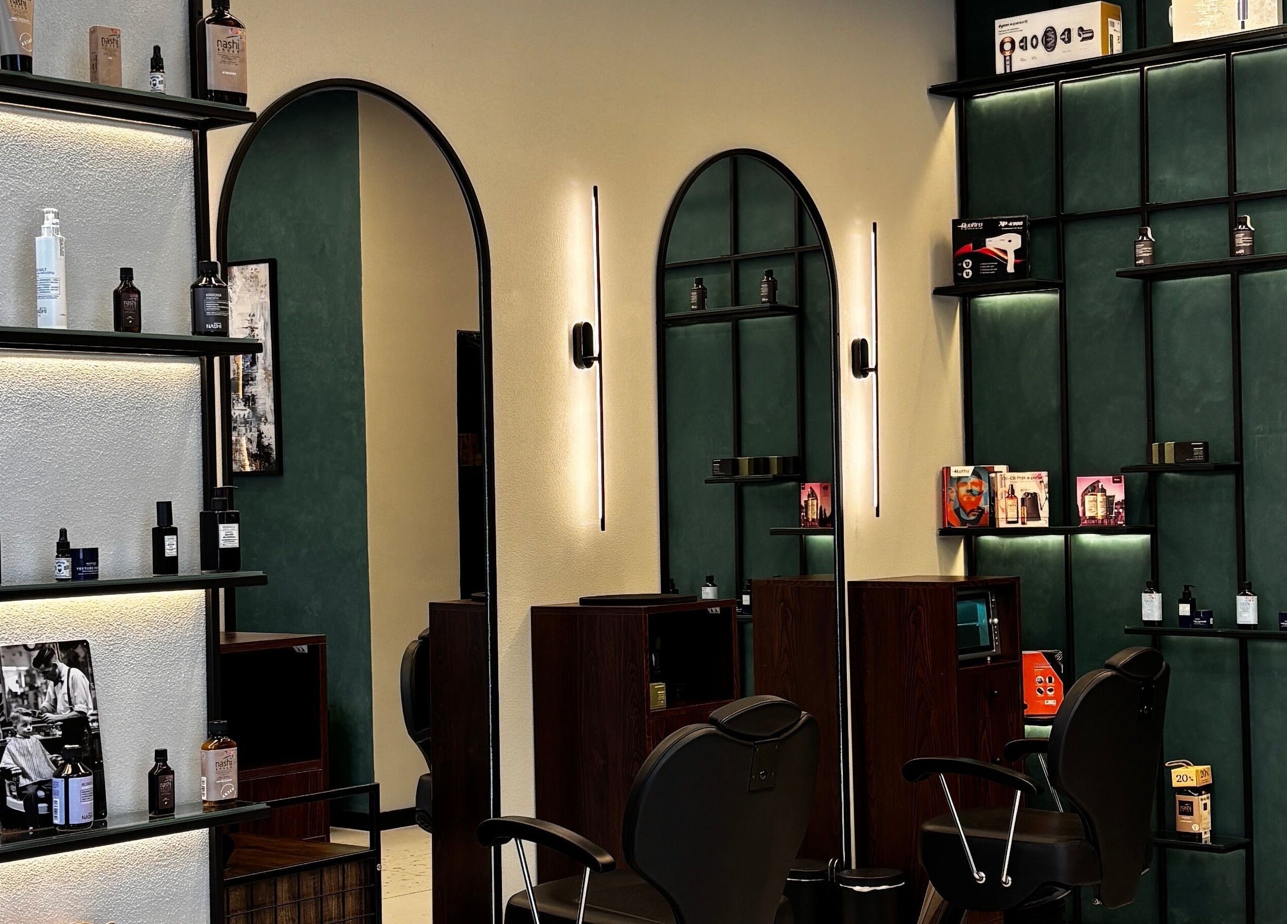 Modern interior of 717 Gents Salon | Dubai Hills featuring sleek shelves and elegant chairs in Dubai, Dubai, AE.