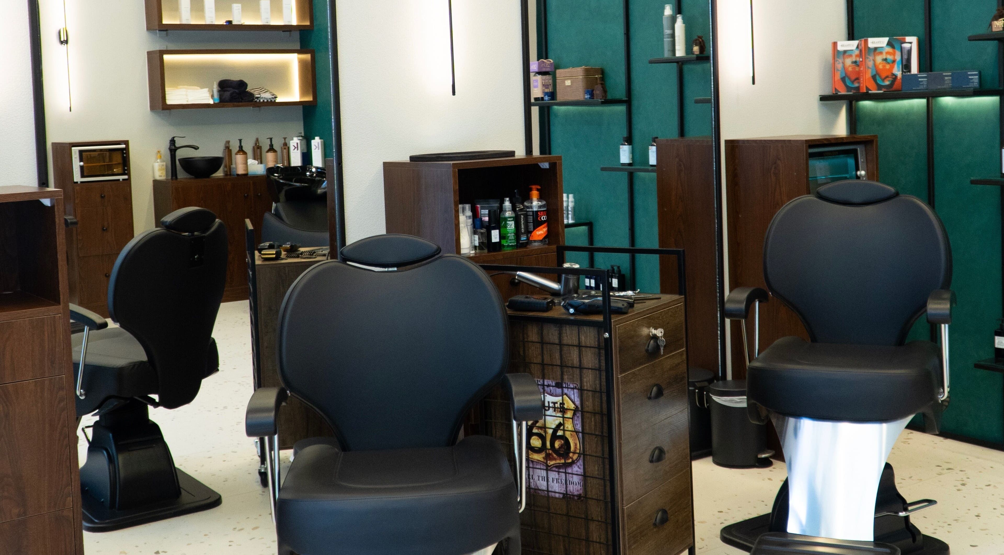 Sleek interior of 717 Gents Salon | Dubai Hills in Dubai, Dubai, AE showcasing modern barber chairs and stylish decor.