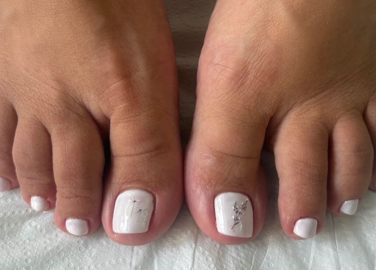Chic pedicure with delicate white polish at Kim’s Beauty Center in Iż-żurrieq, MT.