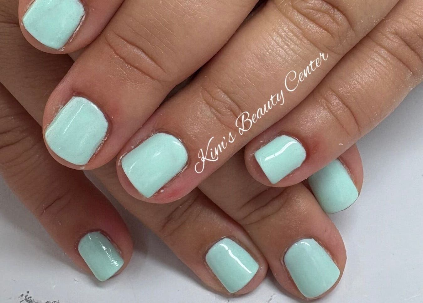 Mint green nails at Kim’s Beauty Center, Iż-żurrieq, MT showcasing a fresh manicure.