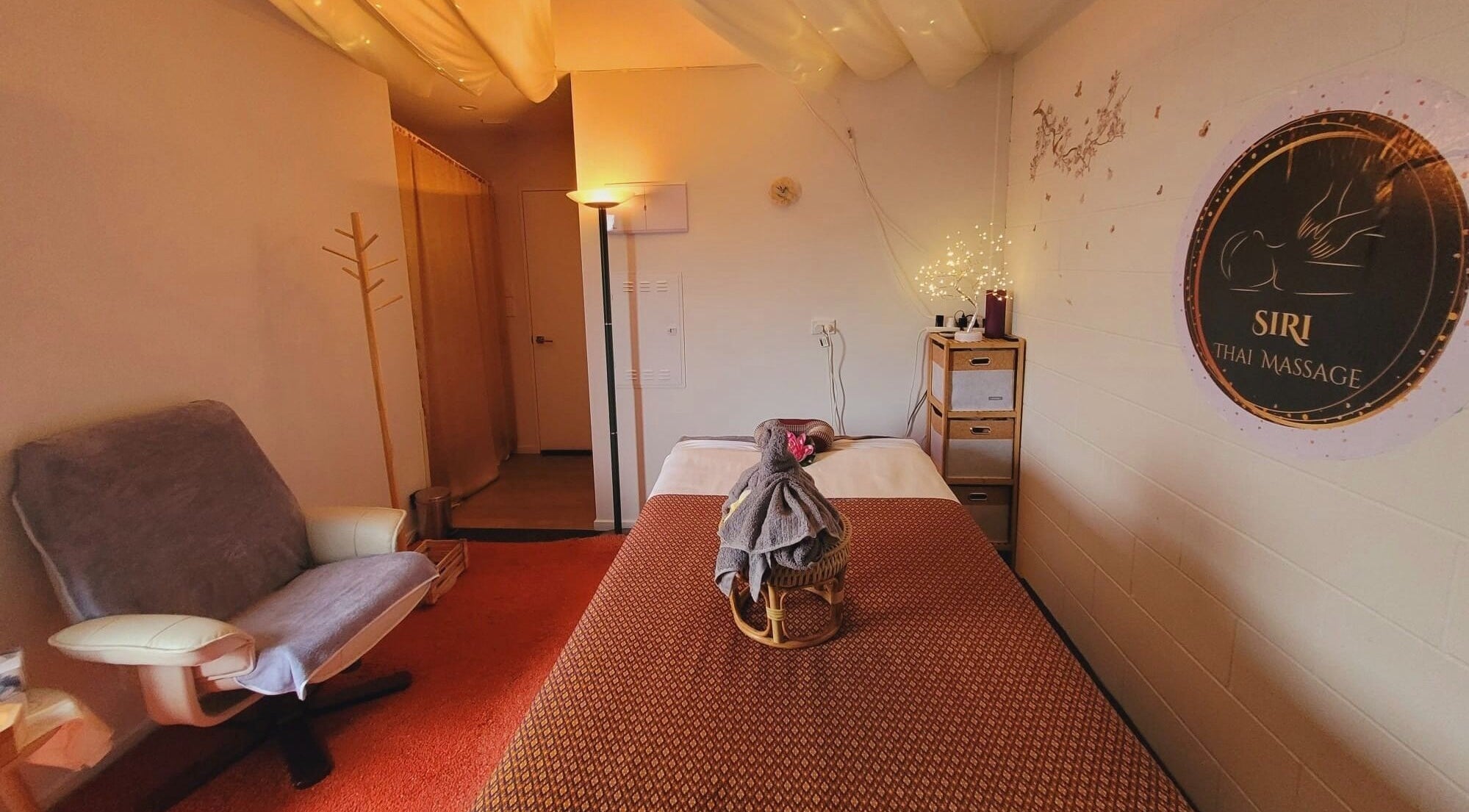 Relaxing massage room at SiRi Thai Massage, Christchurch, Canterbury, NZ, with a cozy ambiance.
