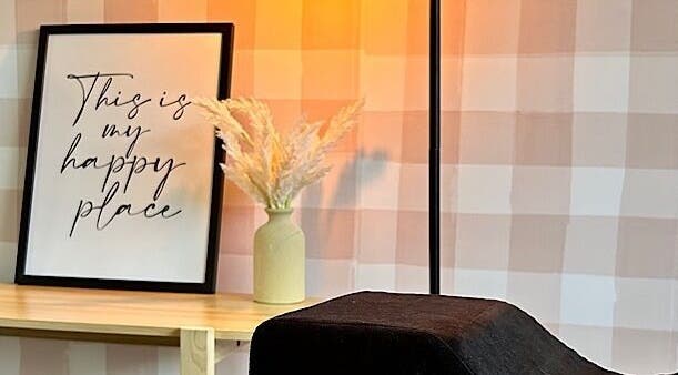 A serene corner at Sundara Beauty, Jubilee Pocket, Queensland, AU, with decor that reads 'This is my happy place'.