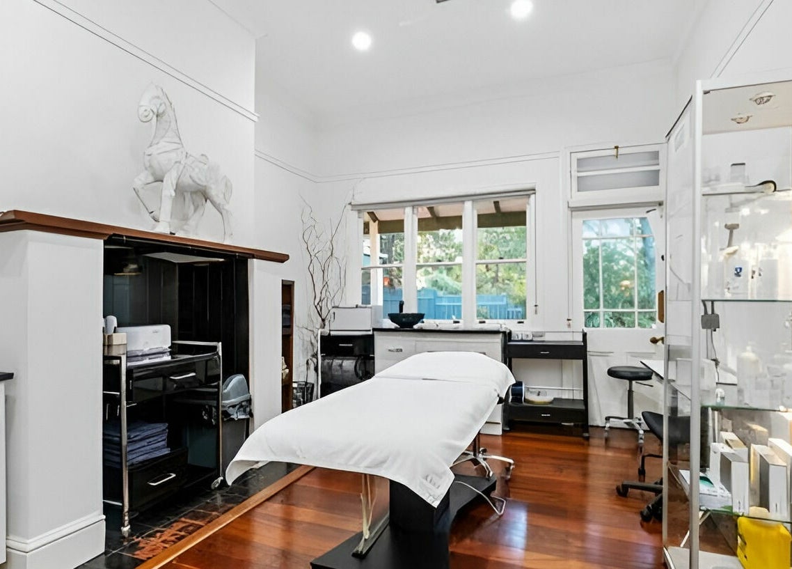 Spacious treatment room at The Beauté Collective in Midland, Western Australia featuring modern decor.