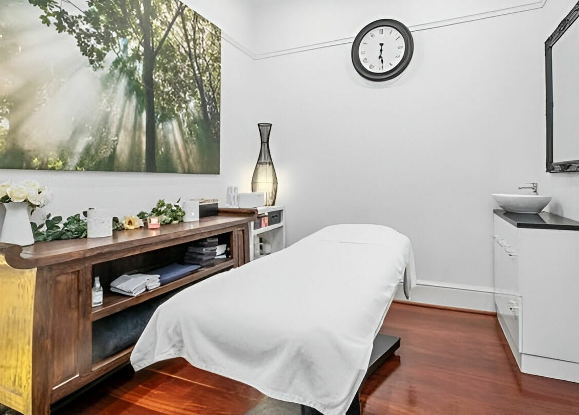 Peaceful treatment room at The Beauté Collective, Midland, Western Australia, AU with calming decor and massage bed.