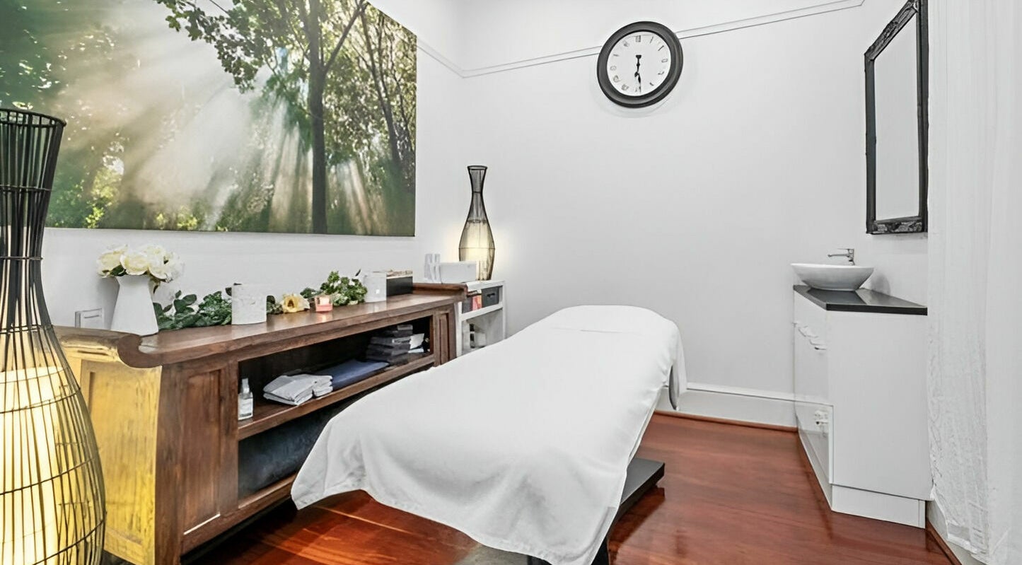 Peaceful treatment room at The Beauté Collective, Midland, Western Australia, AU with calming decor and massage bed.