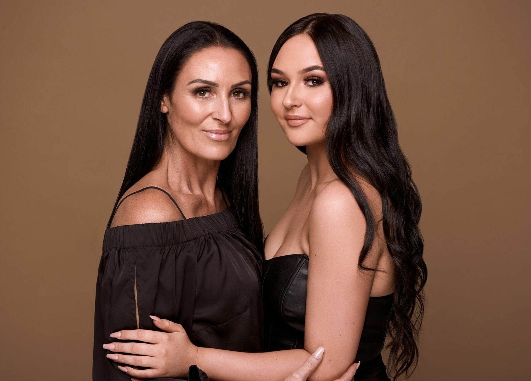 Two women embracing at The Beauté Collective, Midland, Western Australia, AU showcasing beauty and elegance.