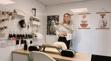HCM Nails stylish workspace featuring tools and art, Falmouth, England, GB. Modern nail salon atmosphere.