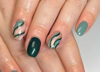 Chic green nail design at HCM Nails, Falmouth, England, GB, showcasing intricate patterns.