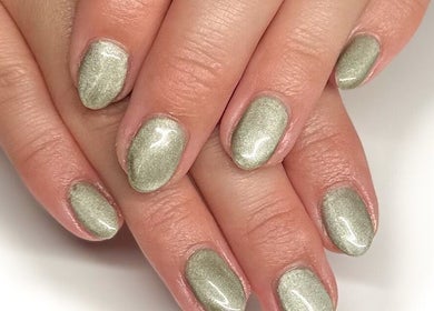 Elegant green nail art by Nails by Hannah Morant in Falmouth, England, GB showcasing a polished look.