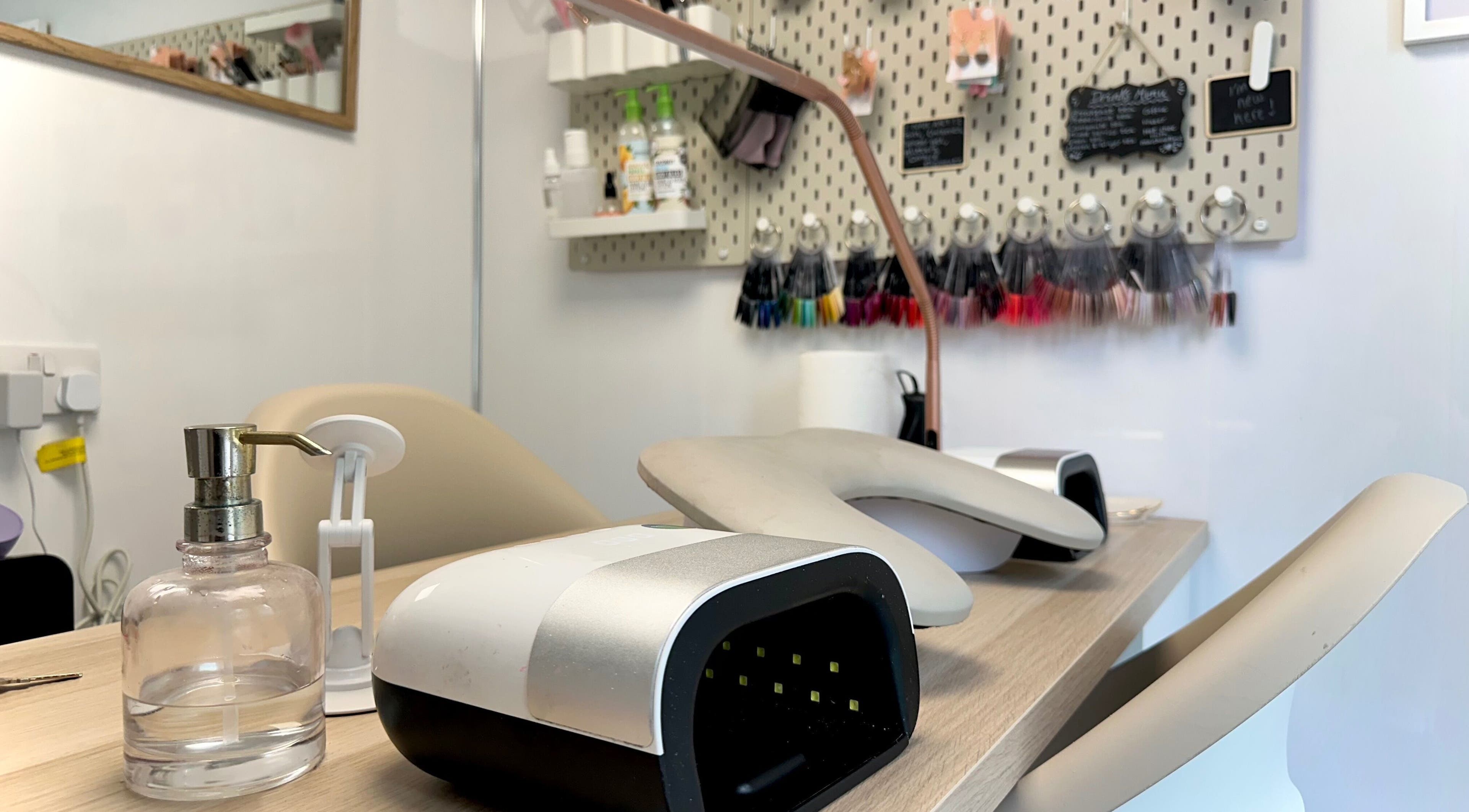 Modern nail station at Nails by Hannah Morant in Falmouth, England, GB, with manicure tools and decor.