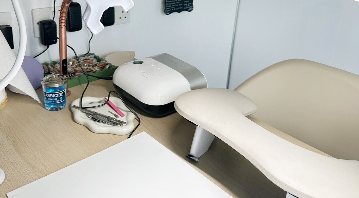 Manicure station at Nails by Hannah Morant, Falmouth, England, GB, featuring tools and LED lamp.
