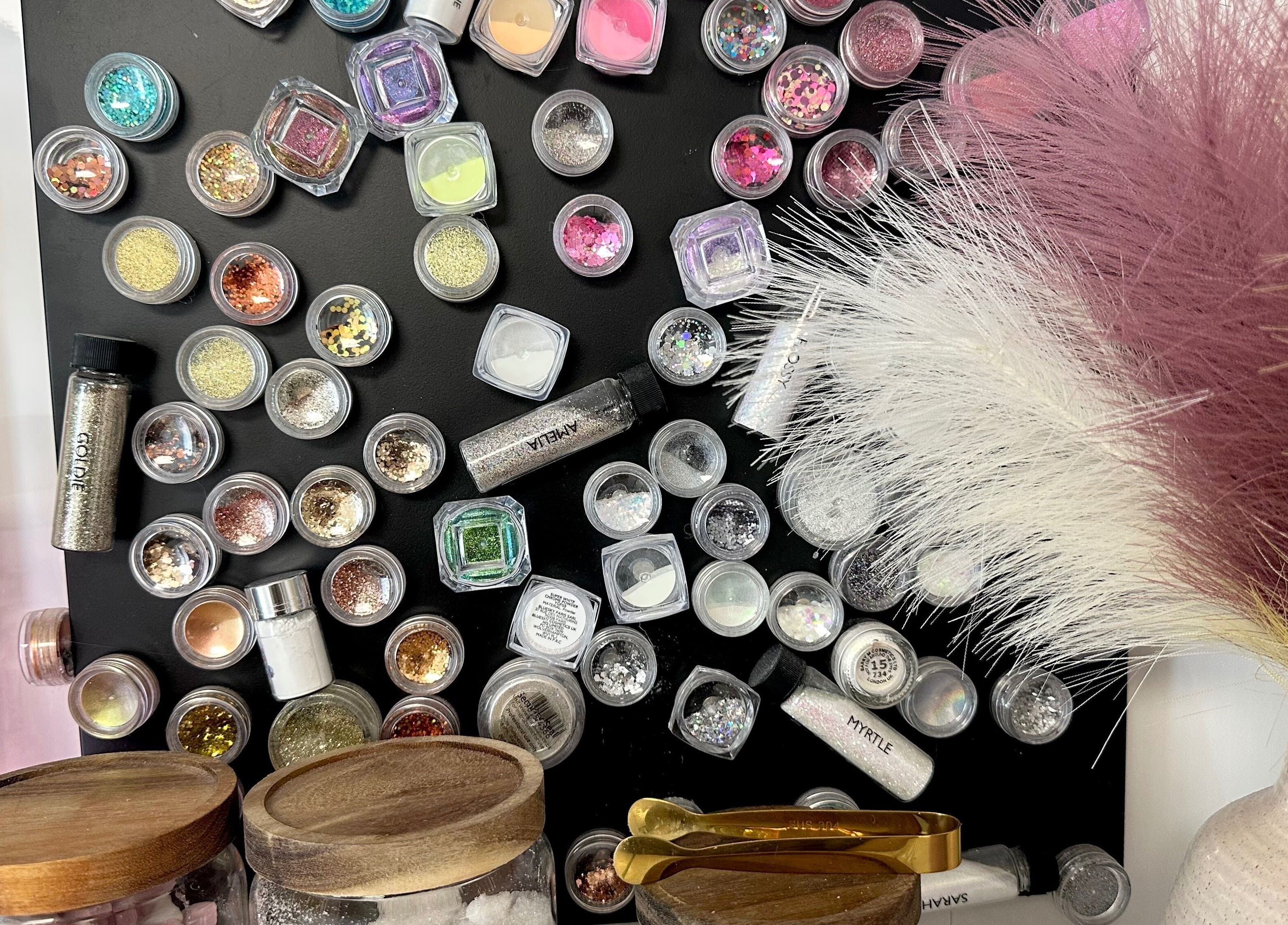 Variety of nail glitters at Nails by Hannah Morant, Falmouth, England, GB highlighting artistic options.