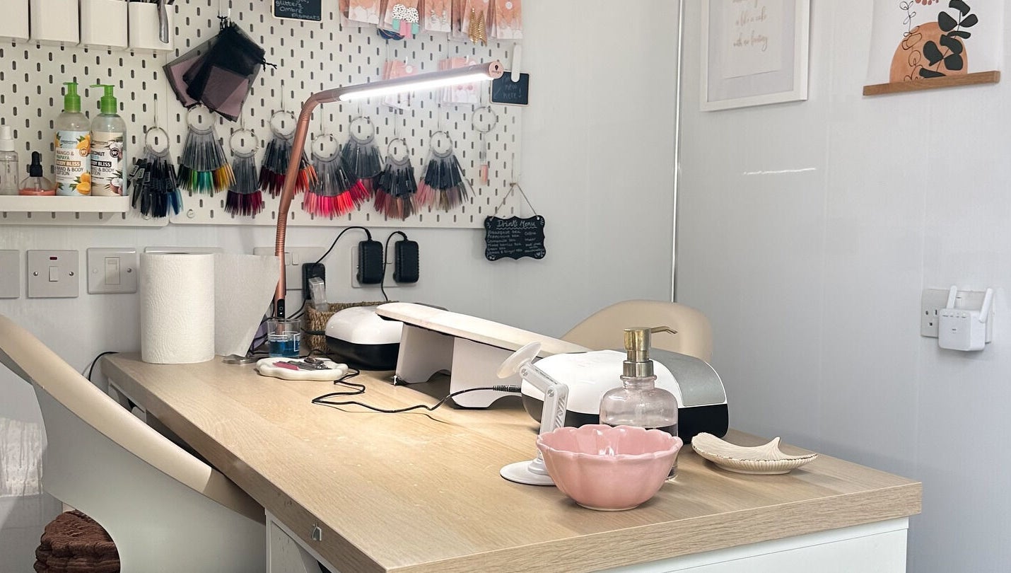 Cozy nail workstation at Nails by Hannah Morant in Falmouth, England, GB, showcasing tools and color samples.