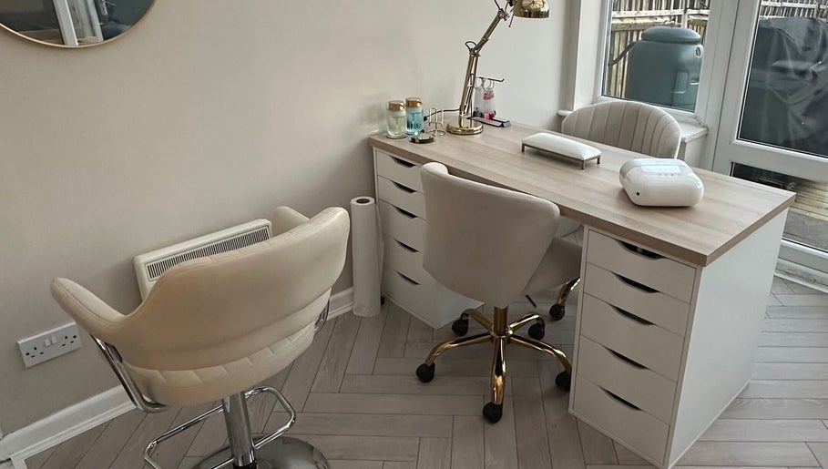 Modern nail station at GB Hair & Beauty in Cowplain, England, GB, featuring chic chairs and elegant decor.
