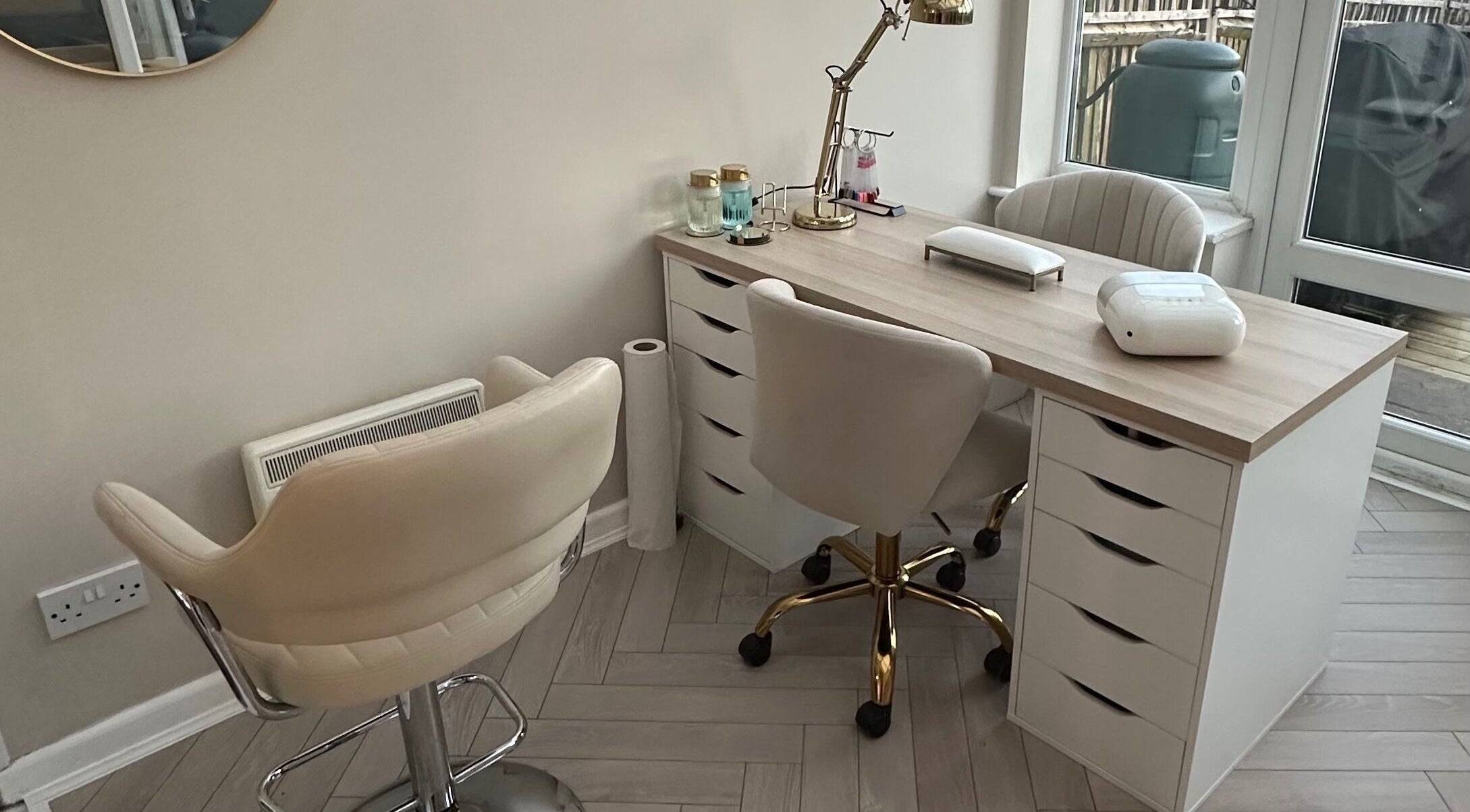 Modern nail station at GB Hair & Beauty in Cowplain, England, GB, featuring chic chairs and elegant decor.