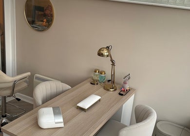 Luxurious manicure station at GB Hair & Beauty, Cowplain, England, GB, featuring chic chairs and decor.