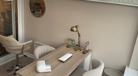 Luxurious manicure station at GB Hair & Beauty, Cowplain, England, GB, featuring chic chairs and decor.