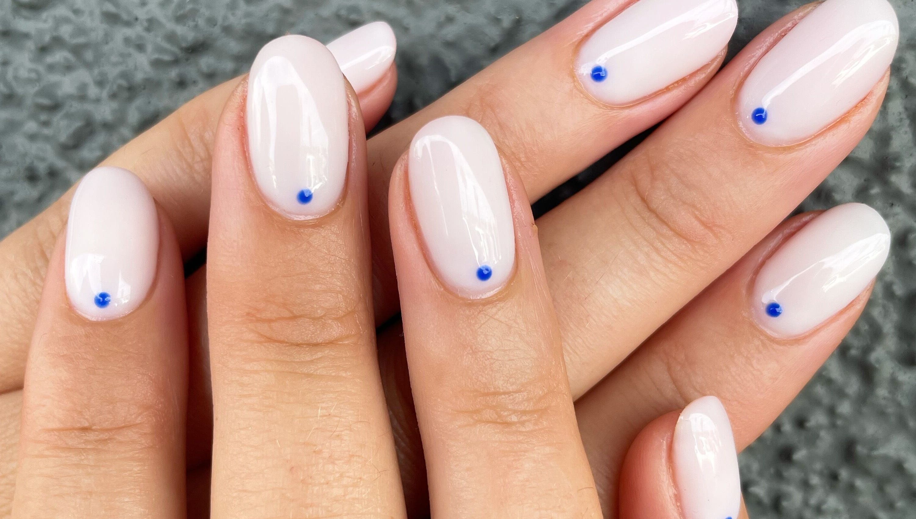 Elegant manicure with blue dot accents at Nails By Jamie, Applecross, Western Australia, AU.