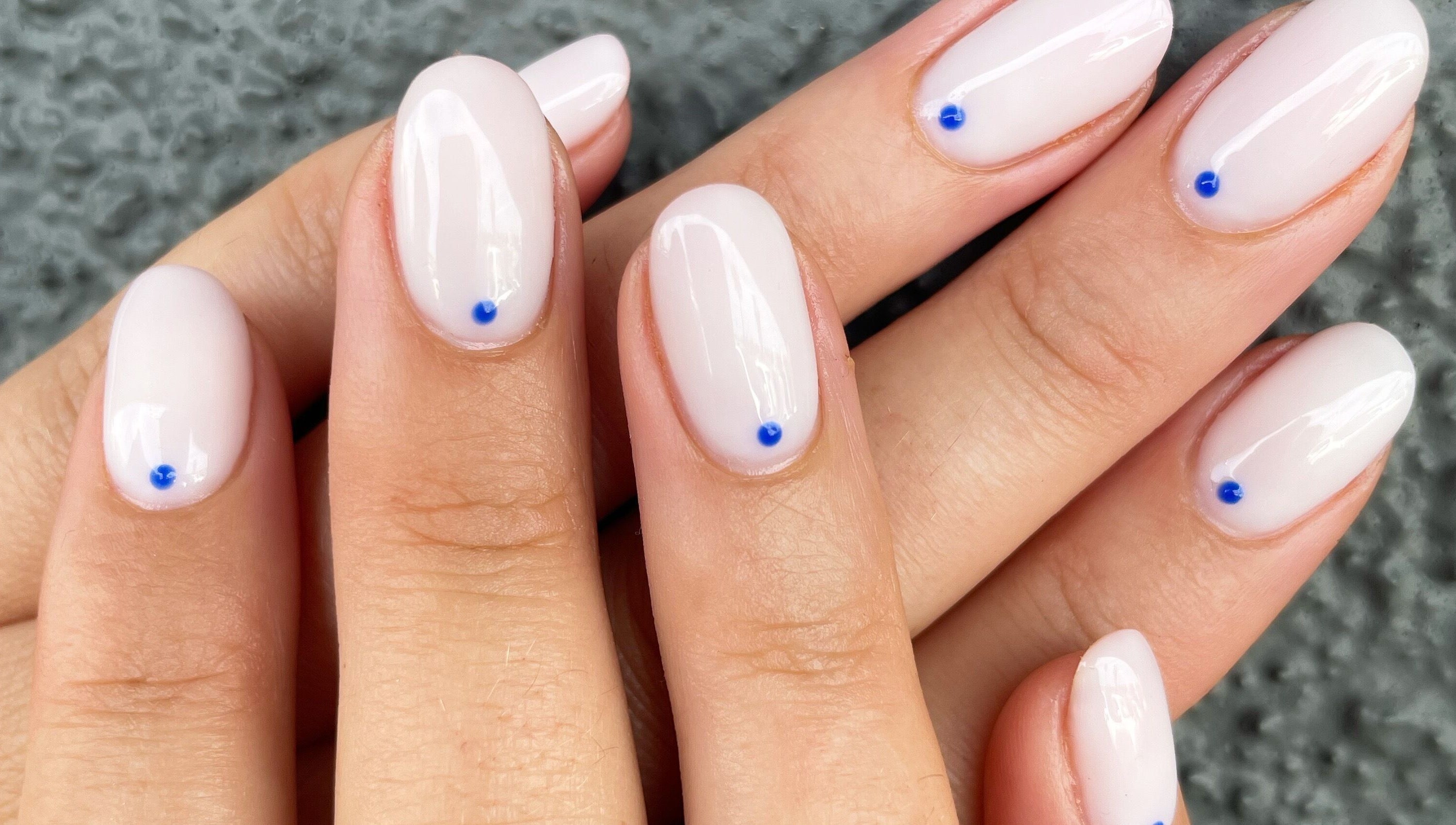 Elegant manicure with blue dot accents at Nails By Jamie, Applecross, Western Australia, AU.