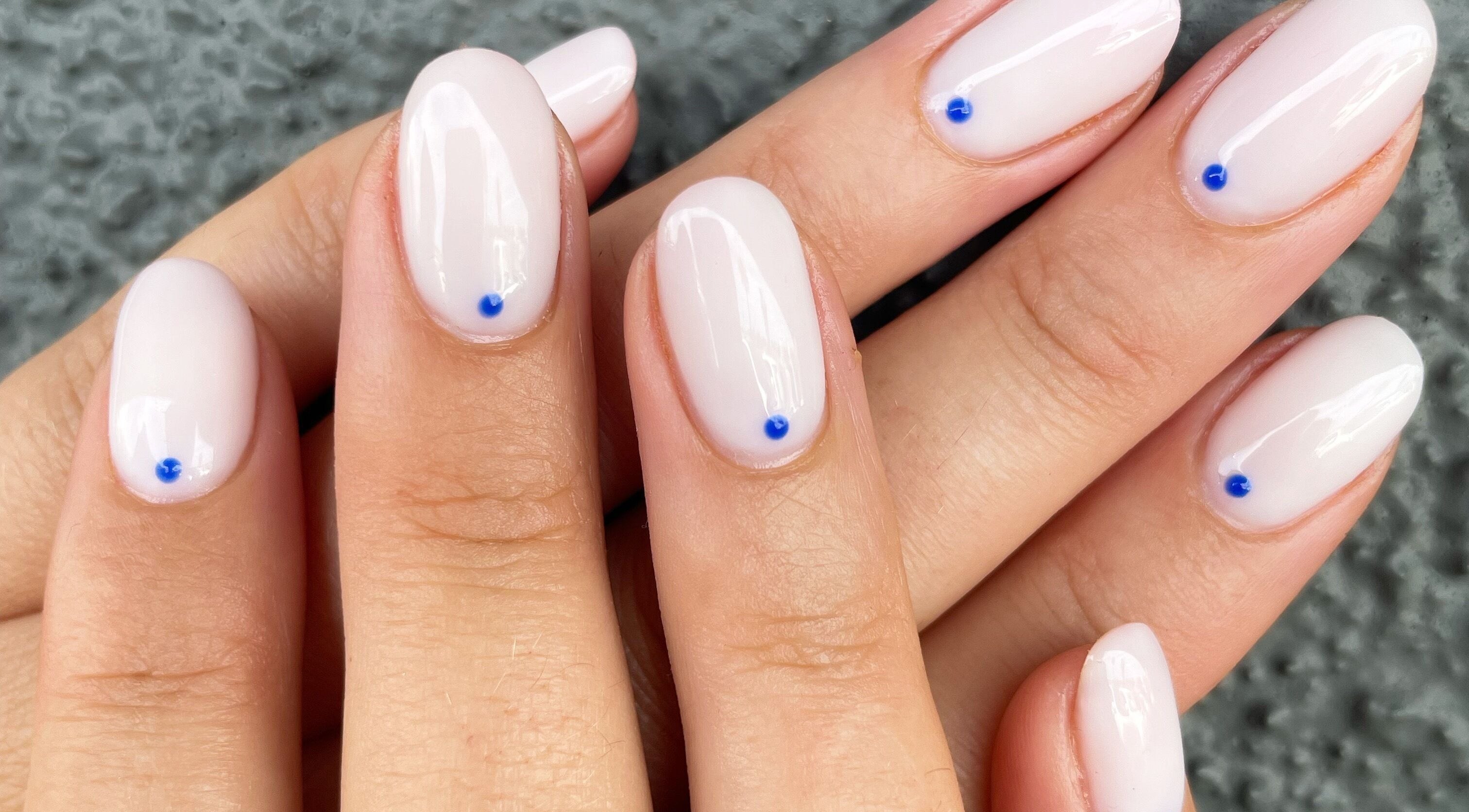 Elegant manicure with blue dot accents at Nails By Jamie, Applecross, Western Australia, AU.
