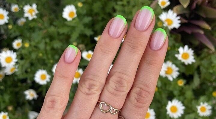 Green French manicure by Nails By Jamie in Applecross, Western Australia, AU with daisies in the background.